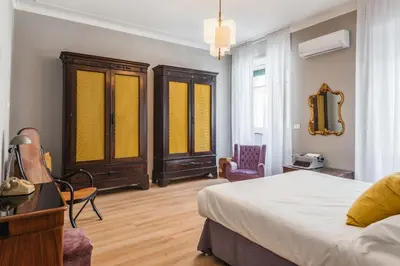 Letto o letti in una camera di Riva House Catania by Wonderful Italy