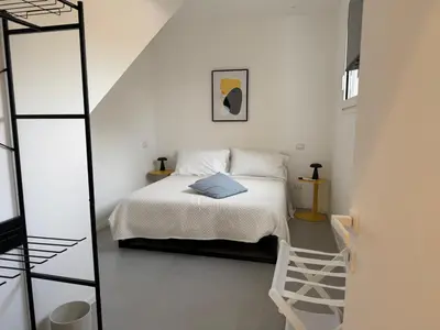 Letto o letti in una camera di iitana Luxury Apartments
