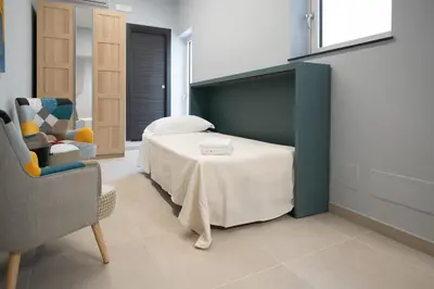 Letto o letti in una camera di iitana Luxury Apartments