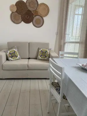 Area soggiorno di Donna Agata House