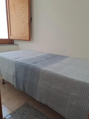 Letto o letti in una camera di Il rifugio del marinaio
