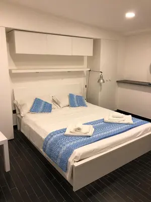Letto o letti in una camera di Belvedere Faraglioni