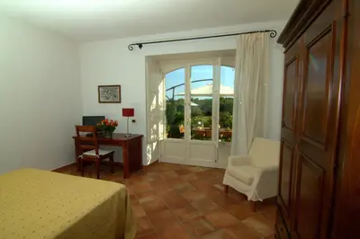 Letto o letti in una camera di Torre Archirafi Resort