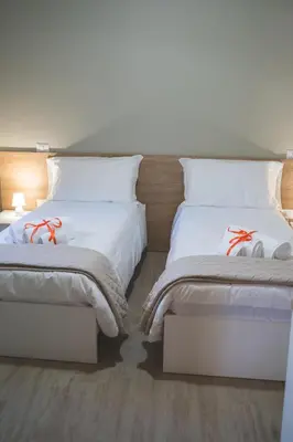 Letto o letti in una camera di Casa Sautu-fau