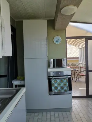 Cucina o angolo cottura di Blue Garden Home Isola Bella Taormina