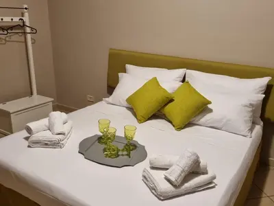 Letto o letti in una camera di STESICORO APARTMENT