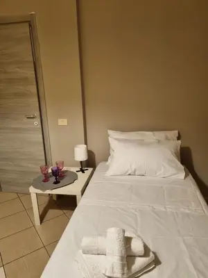Letto o letti in una camera di STESICORO APARTMENT