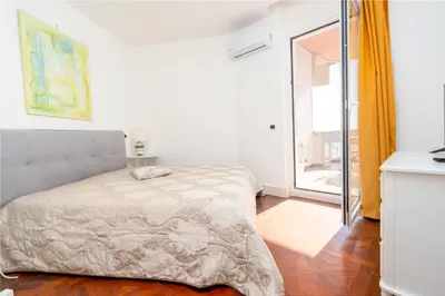Letto o letti in una camera di Perla Marina Sea View Apartment