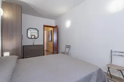 Letto o letti in una camera di GuestHost - Catania Comfy & Central Apartment x3!