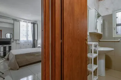 Letto o letti in una camera di GuestHost - Catania Comfy & Central Apartment x3!