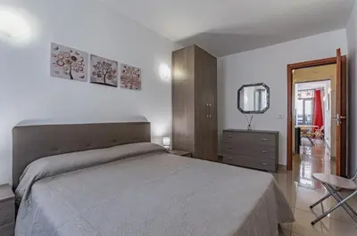 Letto o letti in una camera di GuestHost - Catania Comfy & Central Apartment x3!