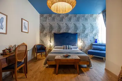 Letto o letti in una camera di Epimonì B&B