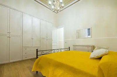 Letto o letti in una camera di Appartamento Martoglio - Casa Vacanze -