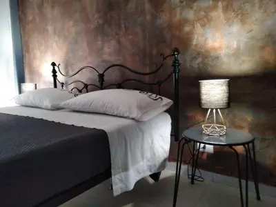 Letto o letti in una camera di Profili Siciliani B&b Ognina Catania