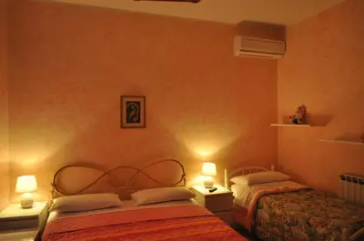 Letto o letti in una camera di B&B Villa Dagala