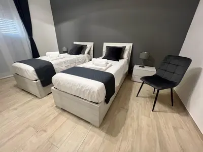 Letto o letti in una camera di Gioeni Home