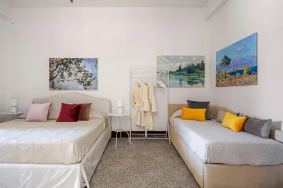 Letto o letti in una camera di Le Dimore del Corso Acireale I - Sicily Stay, fra Catania, Taormina, il Mare e l'Etna