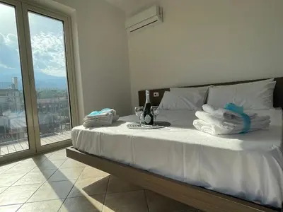 Letto o letti in una camera di Maison de Cheeramie - Tourist Apartments Tra Mare e Etna