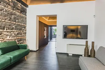 TV o dispositivi per l'intrattenimento presso Leone Apartment with Garden by Wonderful Italy