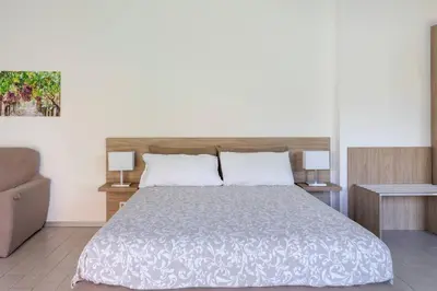Letto o letti in una camera di Villa Persea