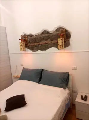 Letto o letti in una camera di Casa del Mare Acitrezza