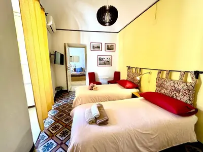 Letto o letti in una camera di AlbaChiara Guesthouse