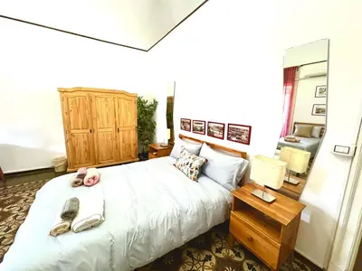 Letto o letti in una camera di AlbaChiara Guesthouse