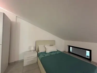 Letto o letti in una camera di Amour Içi Boutique Apartments in centro