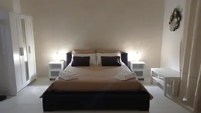 Letto o letti in una camera di L'Antico Cortile di Alba