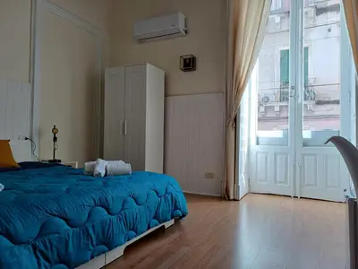 Letto o letti in una camera di Giardino Siciliano B&B