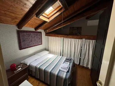 Letto o letti in una camera di Appartamento A casa di Bert - Catania