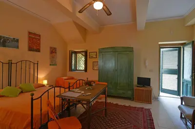 Letto o letti in una camera di Palazzo Nicotra Dimora Storica