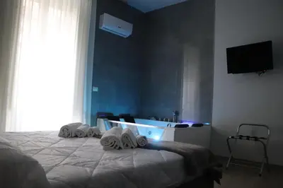 Letto o letti in una camera di IOLETTA HOUSE
