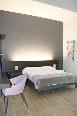 Letto o letti in una camera di IOLETTA HOUSE
