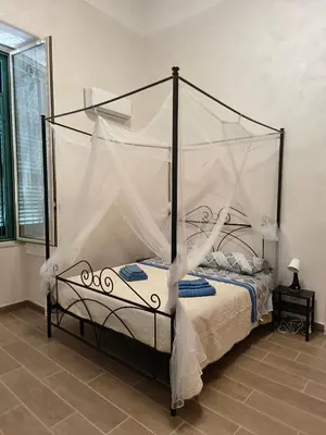 Letto o letti in una camera di Capuana House