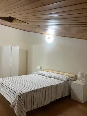 Letto o letti in una camera di La mansarda di melo