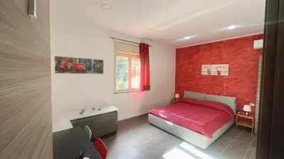 Letto o letti in una camera di Etna &Vita
