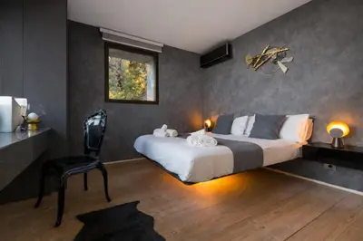 Letto o letti in una camera di Rahal Etna Luxury Retreat- Private Heated Jacuzzi 98F & Infinity Pool