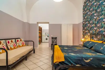 Letto o letti in una camera di Home City Town Catania