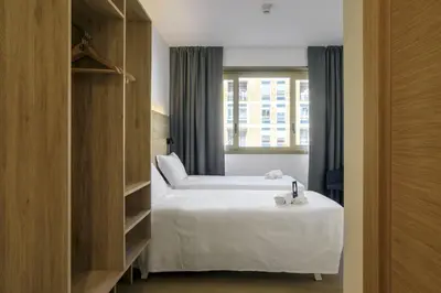 Letto o letti in una camera di B&B HOTEL Catania City Center