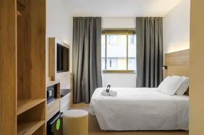 Letto o letti in una camera di B&B HOTEL Catania City Center