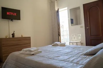 Letto o letti in una camera di Elephant's Rooms Catania