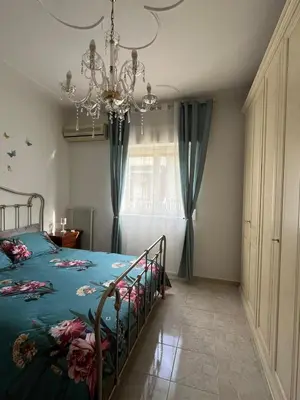 Letto o letti in una camera di SALOTTO DELL'ETNA