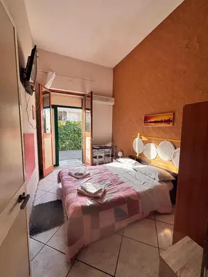 Letto o letti in una camera di LG Appartamento Turistico Acireale
