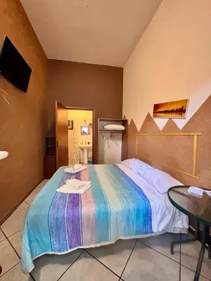 Letto o letti in una camera di LG Appartamento Turistico Acireale