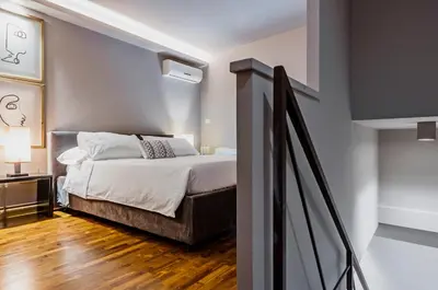 Letto o letti in una camera di Ferrini Home - Residence 150