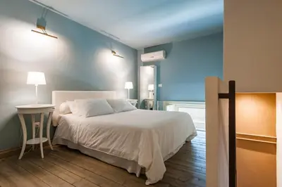Letto o letti in una camera di Ferrini Home - Residence 150