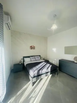 Letto o letti in una camera di La Pigna Casa Vacanza