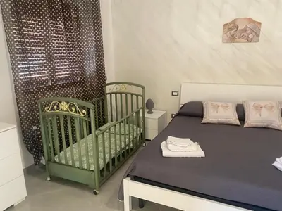 Letto o letti in una camera di La Pigna Casa Vacanza