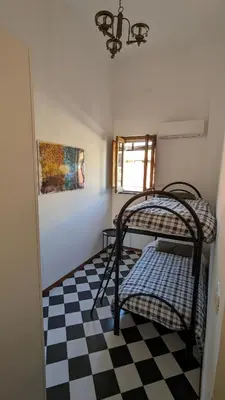 Letto o letti in una camera di Casa vacanze a Nicolosi - Etna - Black and White